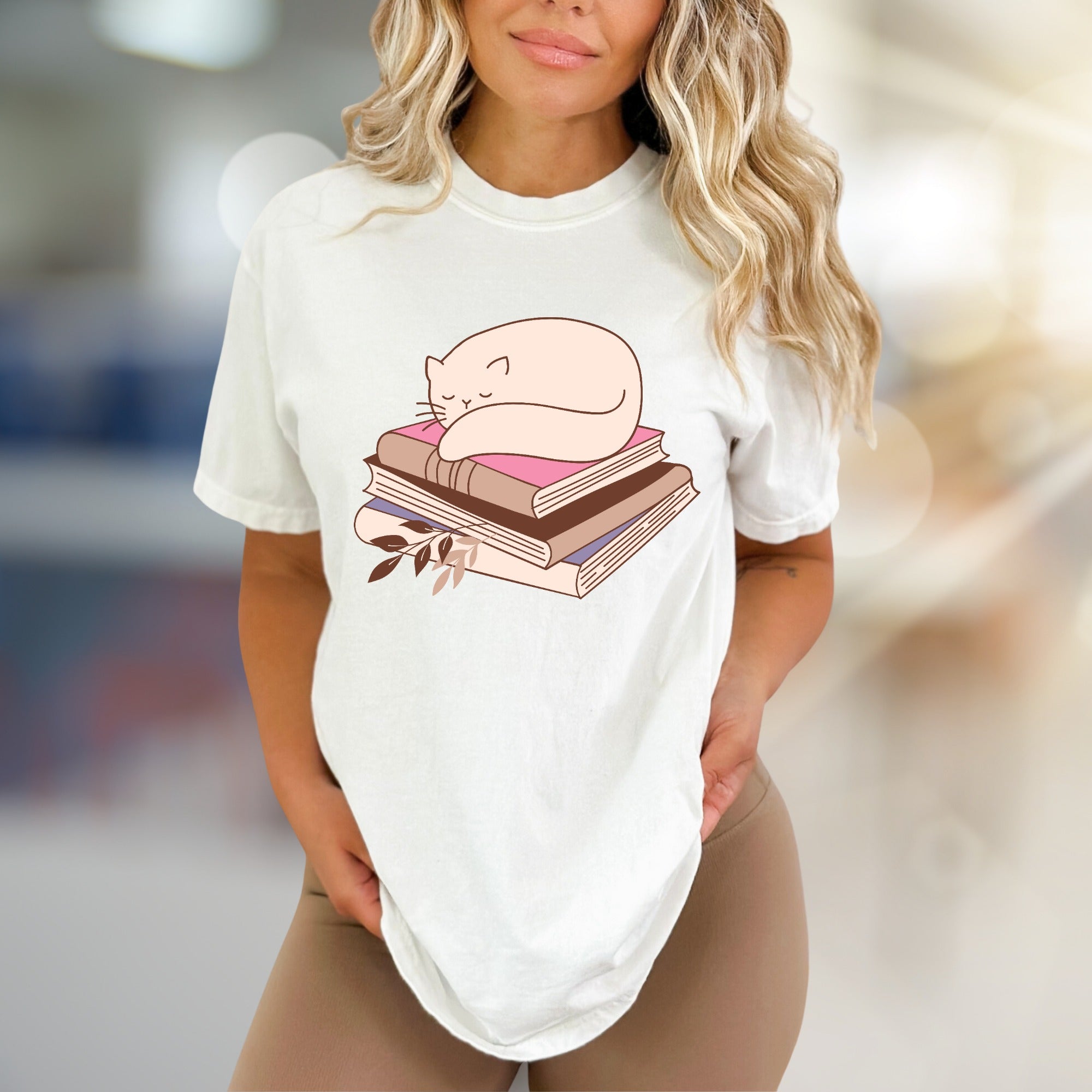 Sleeping Cat on Books Graphic Tee, a Cozy Literary Pick for Book Lovers