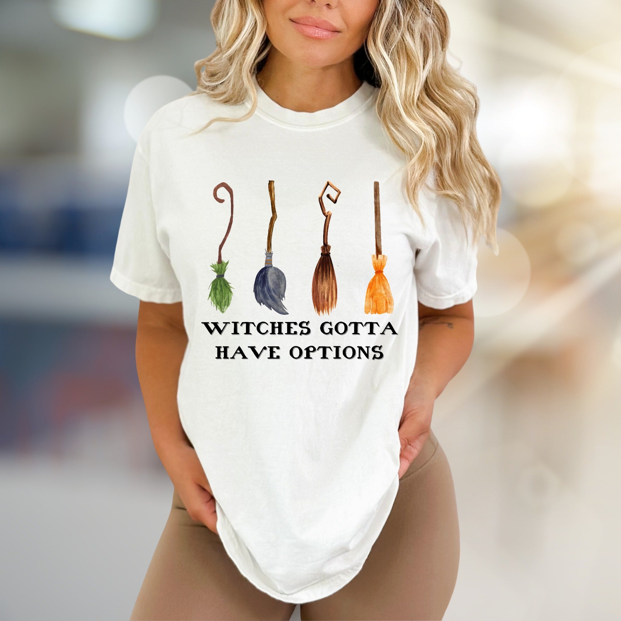 "Witches Gotta Have Options" Halloween Broomstick Graphic Tee, a Whimsical Pick for Halloween Enthusiasts