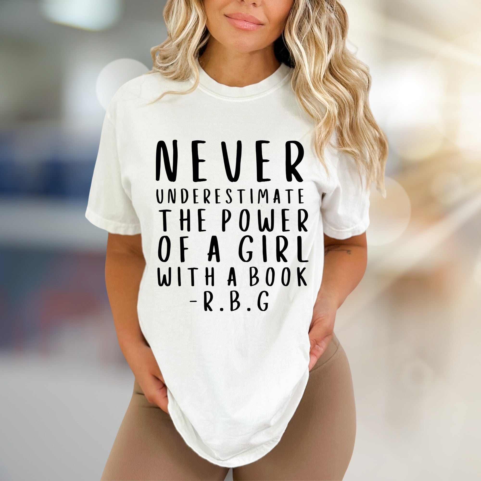 "NEVER UNDERESTIMATE THE POWER OF A GIRL WITH A BOOK -R.B.G" Empowerment Graphic Tee, a Feminist Pick for Readers