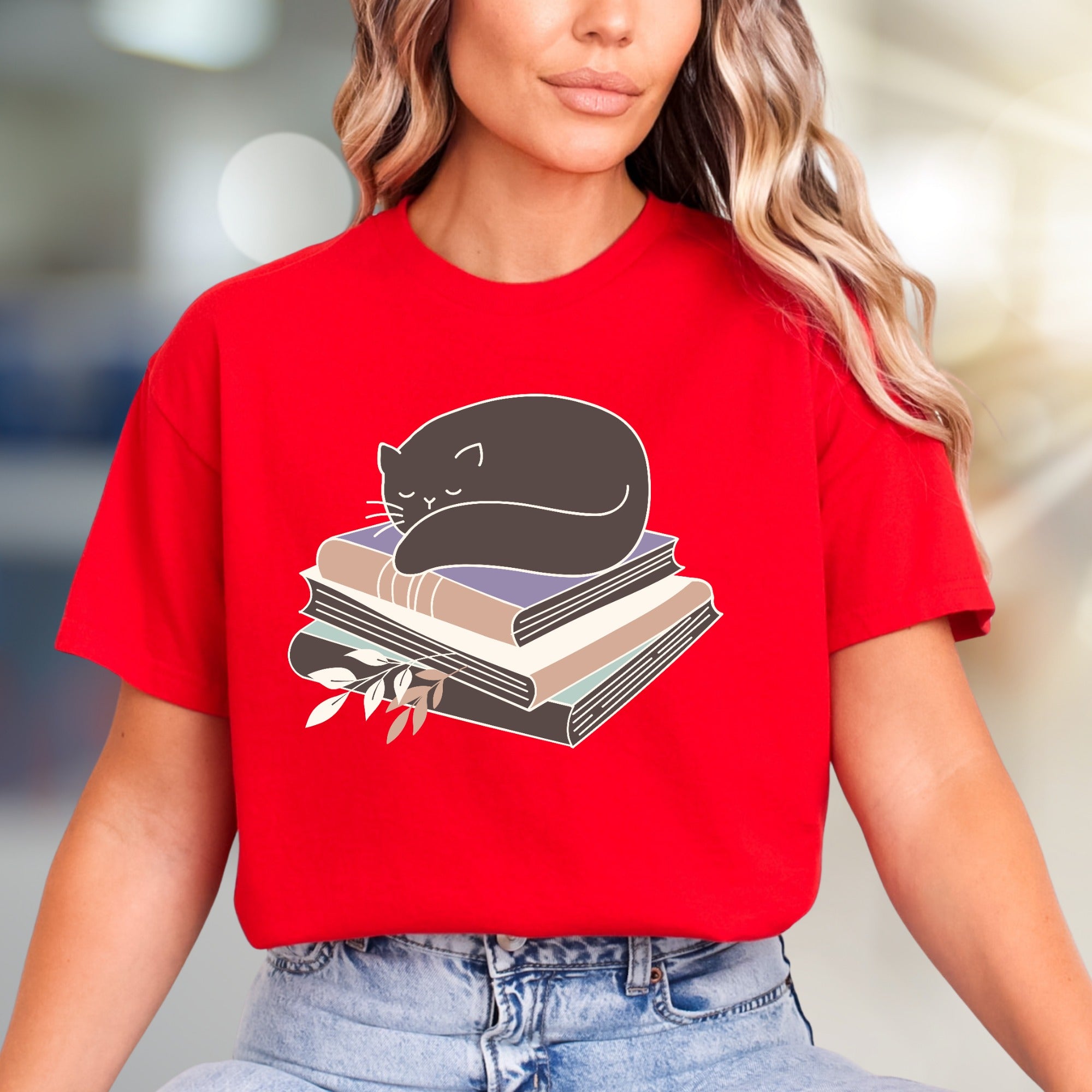 Sleeping Cat on Books Graphic Tee, a Cozy Literary Pick for Book Lovers