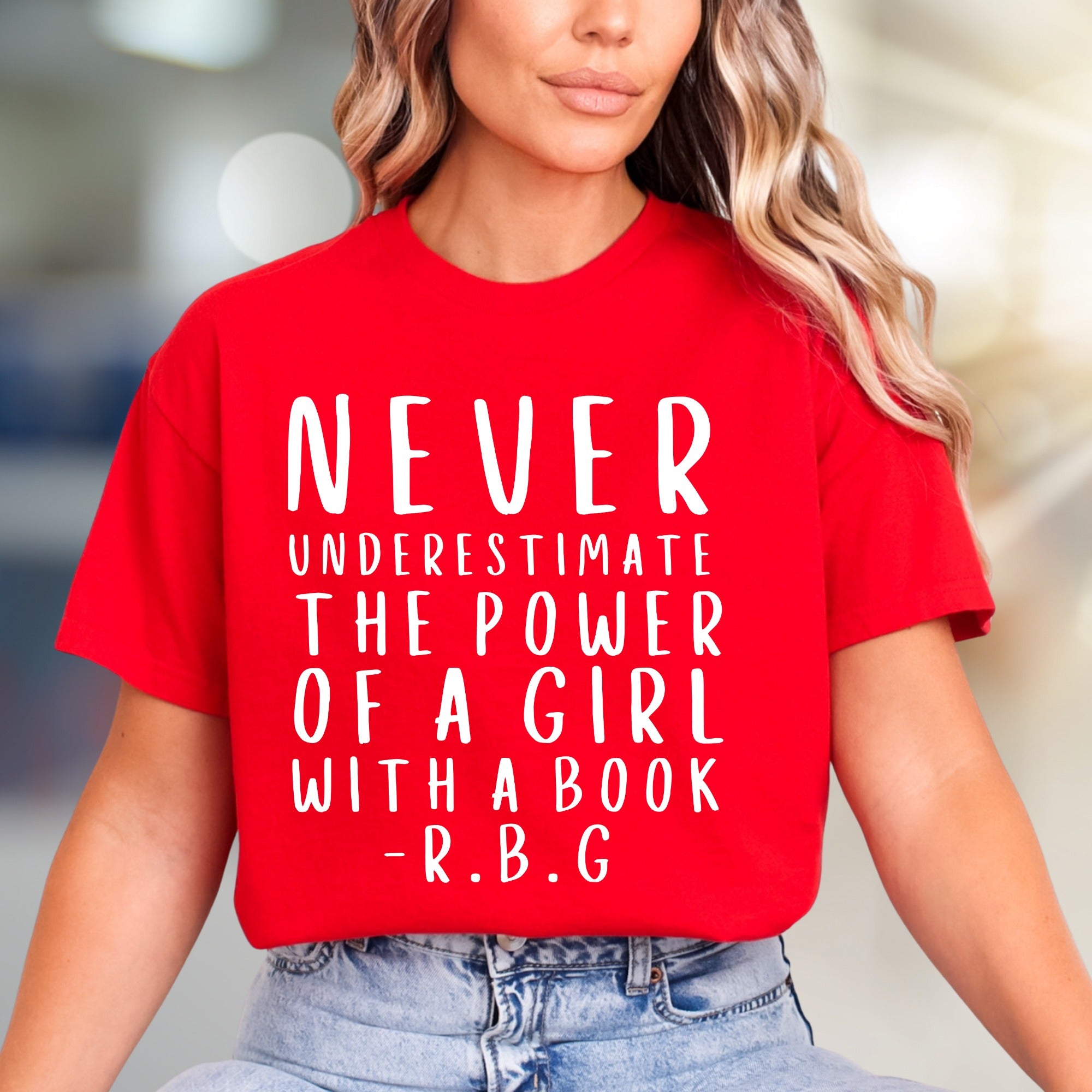 "NEVER UNDERESTIMATE THE POWER OF A GIRL WITH A BOOK -R.B.G" Empowerment Graphic Tee, a Feminist Pick for Readers